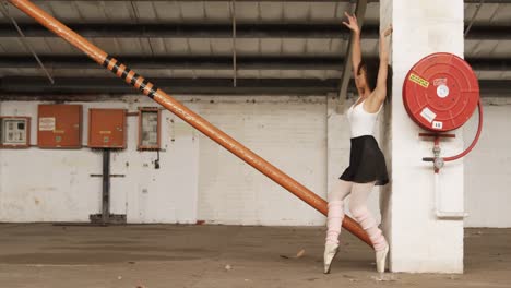 Female-dancer-in-an-empty-warehouse