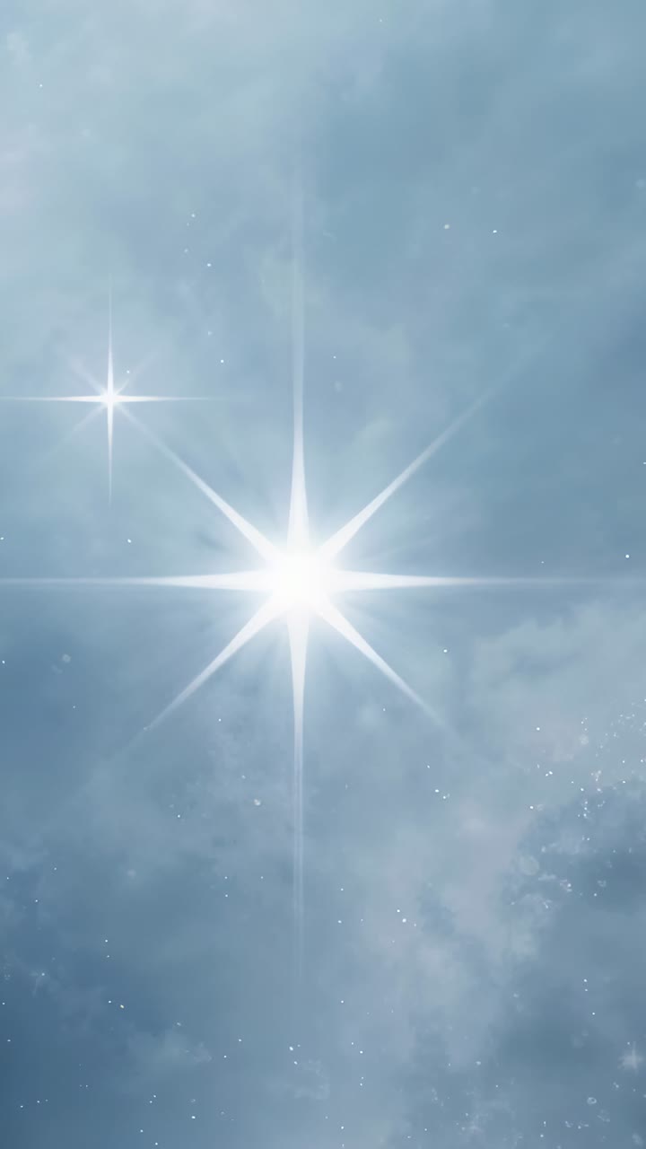 Vertical video: Shining central star flare, sunlight causing beam in blue sky, with left glint