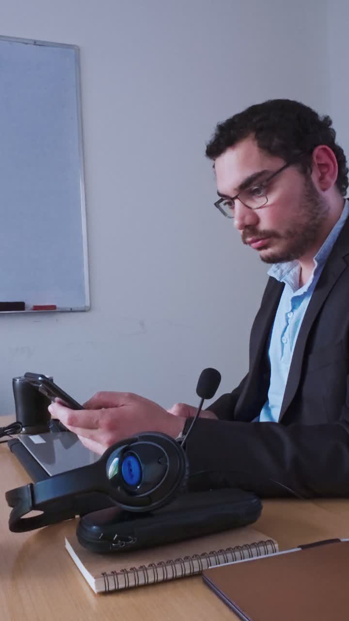 Businessman Seriously Reading a Message on His Smartphone