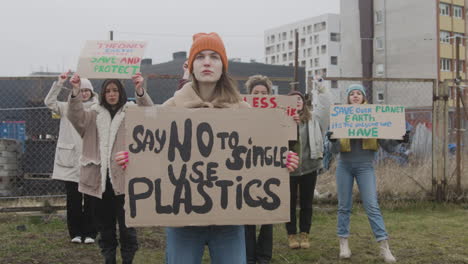 group of young female activists with banners protesting against climate change 4