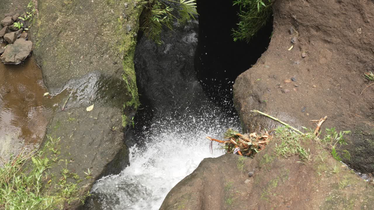 Powerful water stream cascade waterfall pouring debit Bali island Indonesia