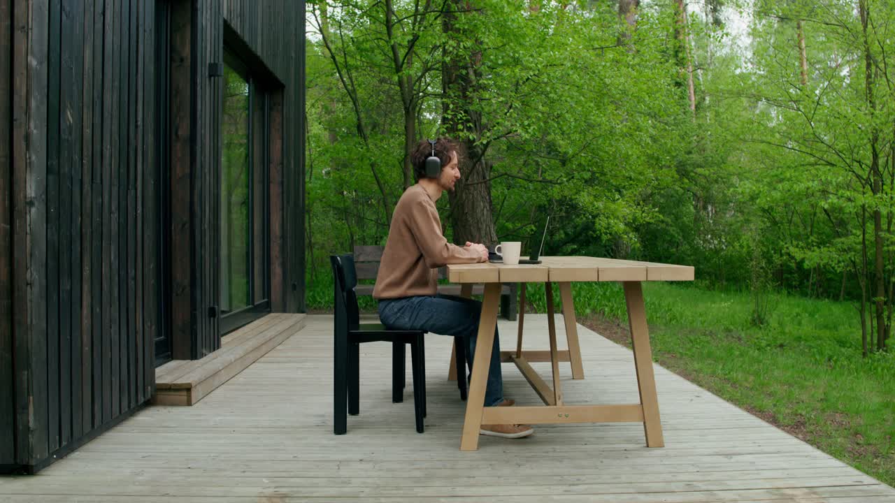Man working from home on a deck