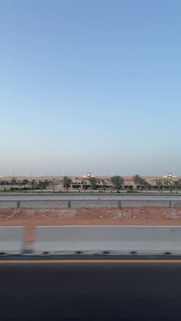 a view of a desert from a car on high way, trucking shot