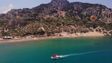parasailing at tsambika beach in rhodes, greece