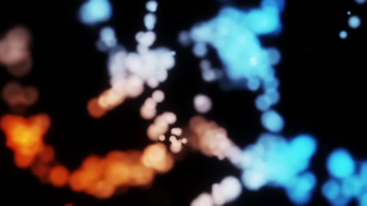 Vibrant Abstract Smoke and Light Display with Dynamic Color Transitions from Warm to Cool Hues against a Dark Background