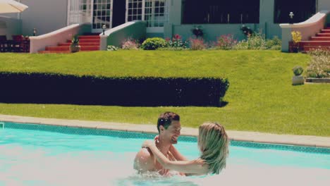 Couple-having-fun-together-in-the-swimming-pool