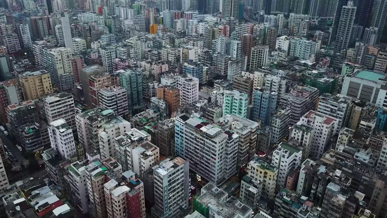 Aerial view closing in on mass buildings in Sham Shui Po, one of the poorest district of Hong Kong.
