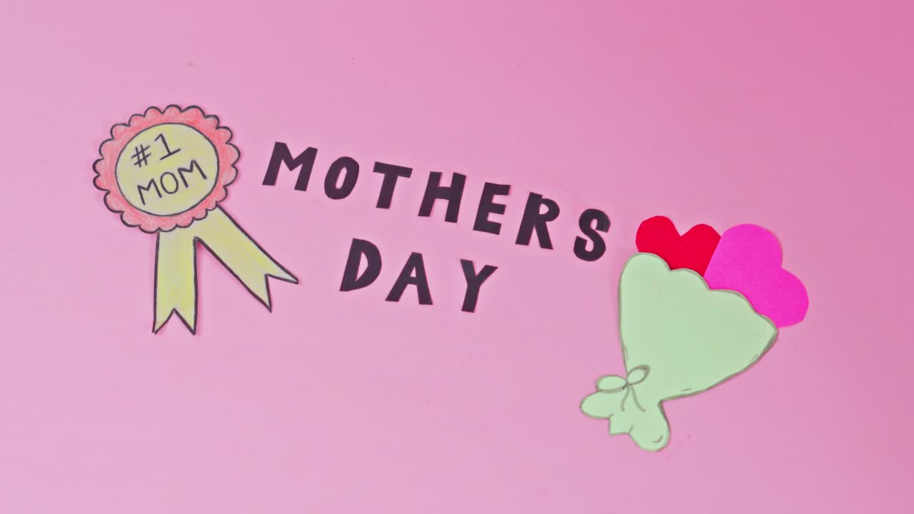 Sweet Mother's Day design featuring #1 Mom medal and paper flowers on pink