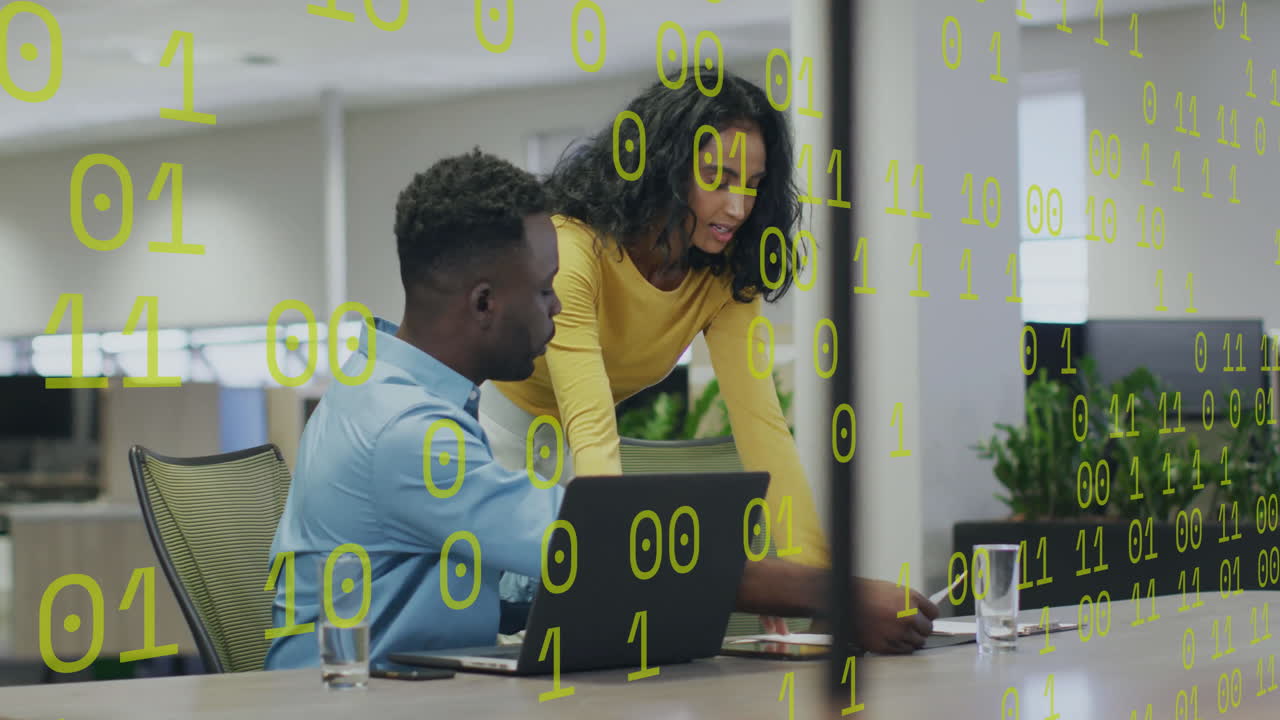 Animation of binary coding over diverse colleagues discussing work
