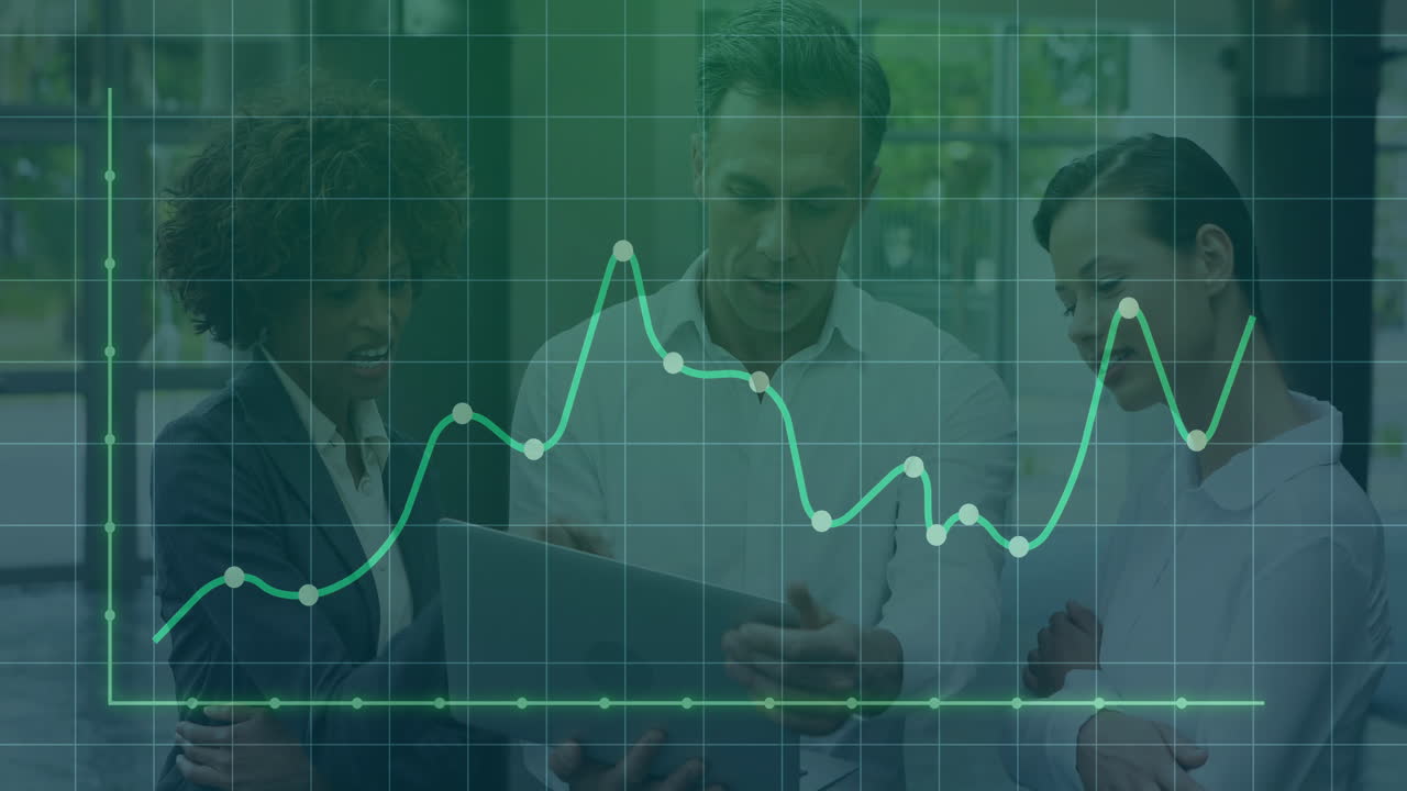 Analyzing data with graph overlay, business professionals collaborating in office
