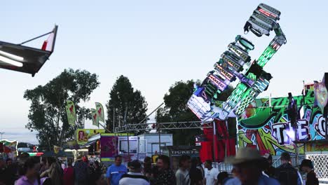 colorful ride spinning at a crowded fair