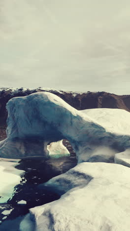 stunning iceberg arch in arctic or antarctic