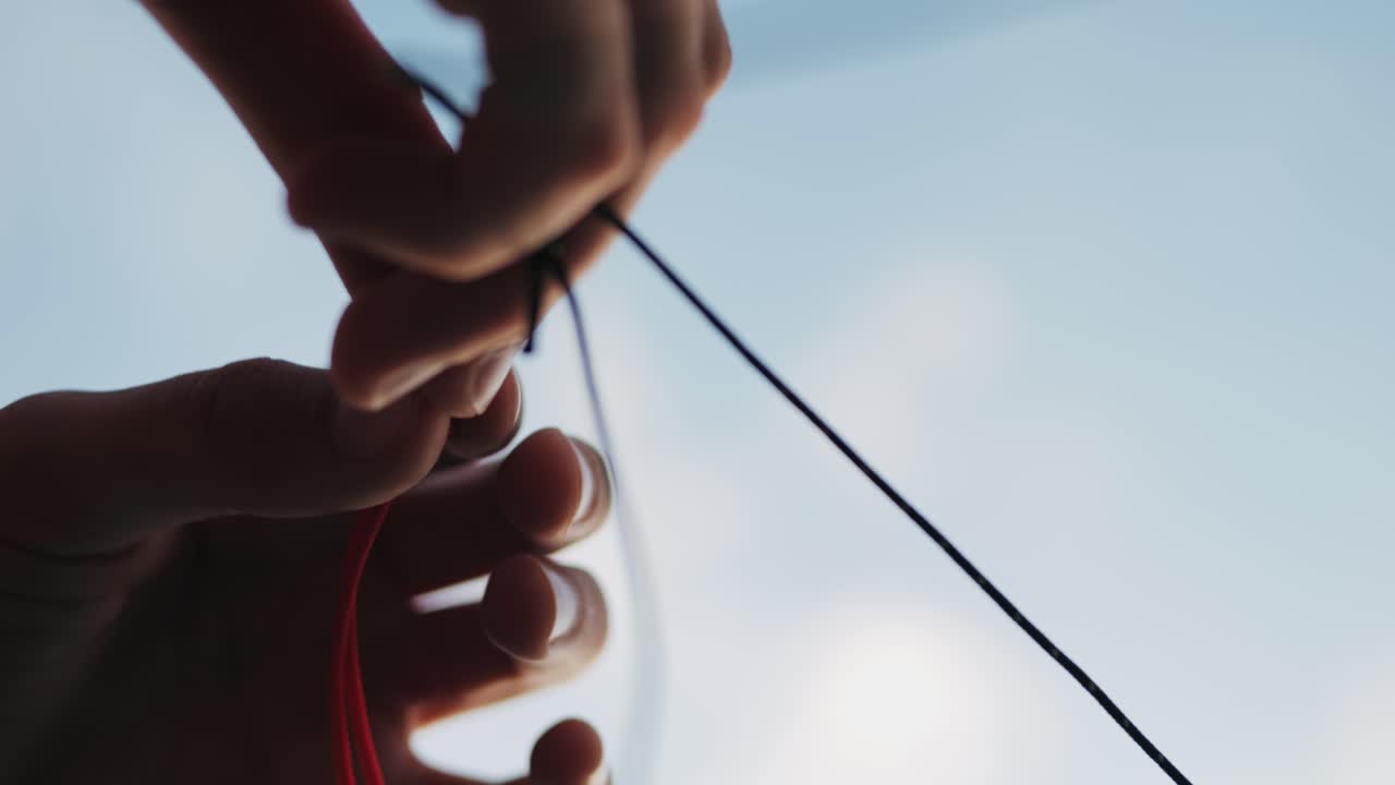 Smiling caucasian child playing with kite on the beach in white clothes. High quality 4k footage
