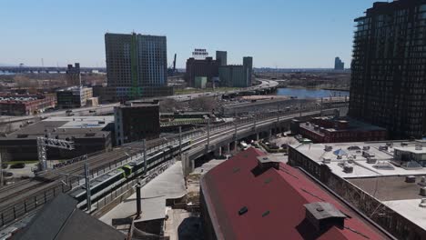 rem subway train in montreal city drone following electric public infrastructure transportation driving around modern smart city