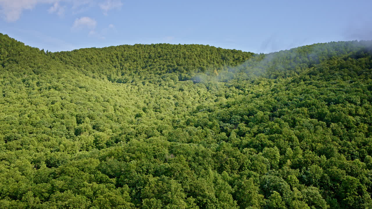Drone flight over fog-covered Smoky Mountain valleys in NC