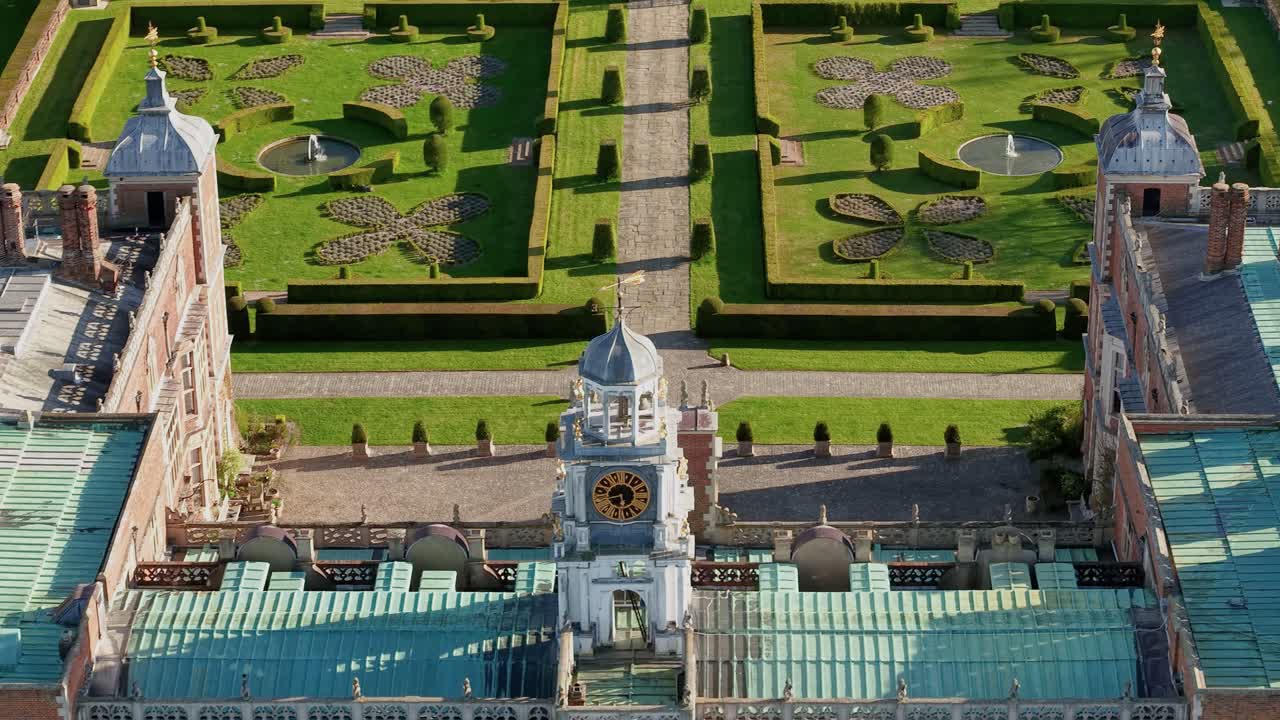 Ornate Hatfield house clock tower aerial view overlooking grand decorative country estate gardens