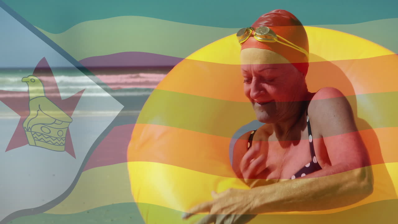 Elderly woman with swim cap enjoying beach over Zimbabwe flag animation