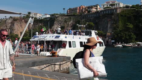 tourists boarding a yacht at sorrento dock