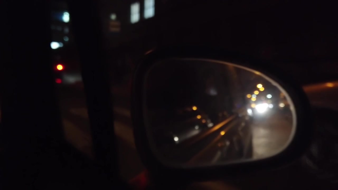Car traffic on the streets of the night city. Out of focus.