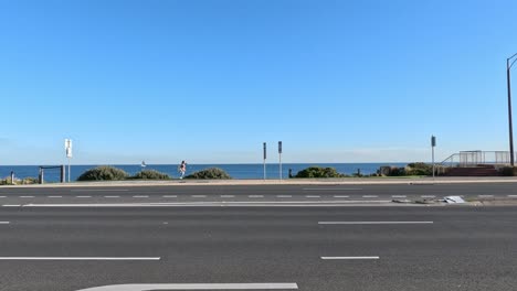 vehicles driving along the coastal road