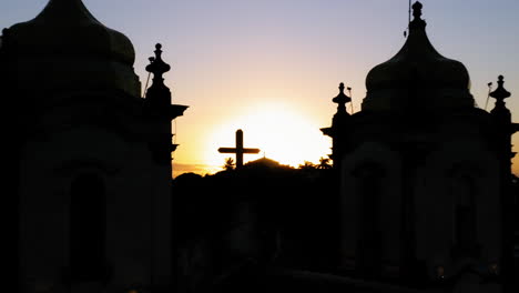 Aerial-view-of-the-the-silhouette-of-the-top-Nosso-Senhor-do-Bonfim-church,-illuminated-at-sunset,-Salvador,-Bahia,-Brazil