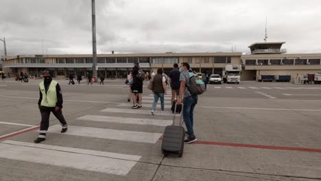 Hispanic-Male-Dragging-Suitcase-on-Airspace-Run-Way-at-a-South-African-Airport