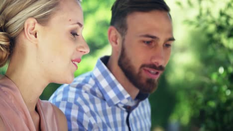 Couple-interacting-with-each-other-at-restaurant