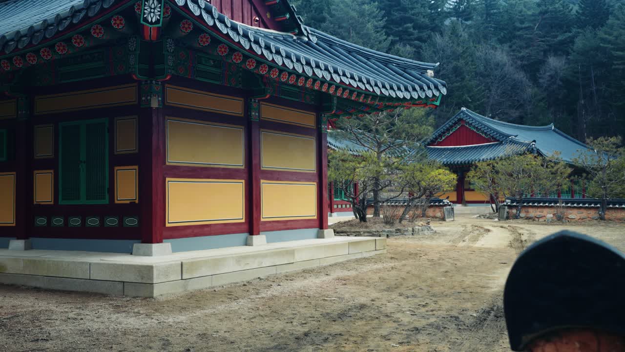 View of traditional Korean Buddhist temple buildings with ornate roofs and colorful wooden details at Sangwonsa Temple in Pyeongchang South Korea