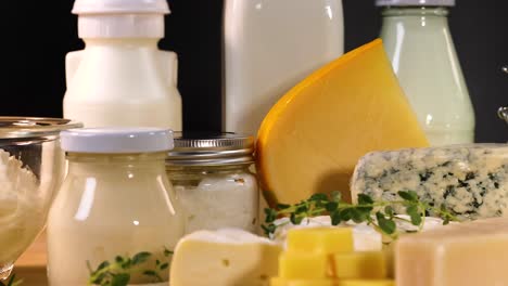 various dairy items arranged on a black background