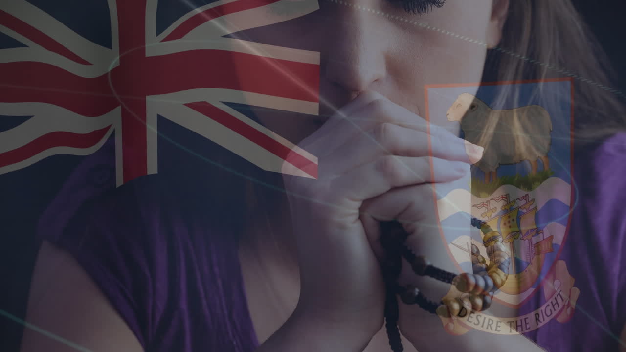 mujer orando con cuentas de rosario sobre la bandera británica y el escudo de armas de las bermudas animación