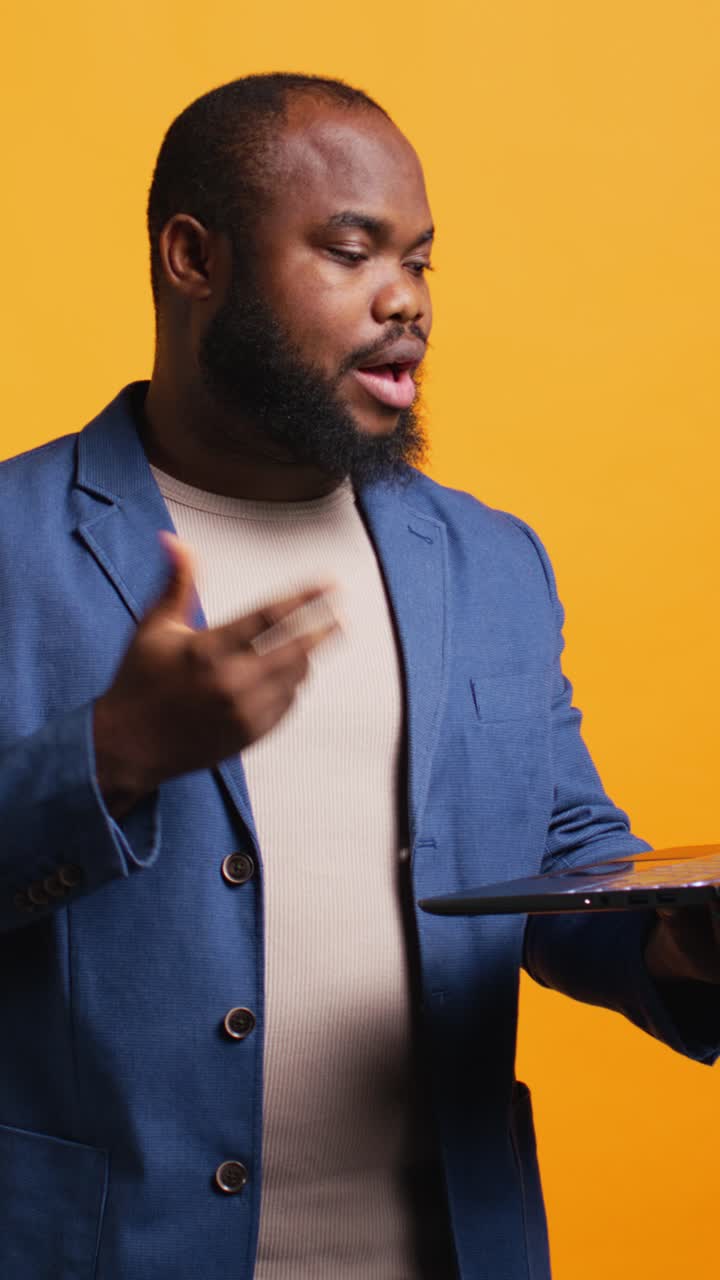 African American Man Waving and Talking on Video Call with Laptop