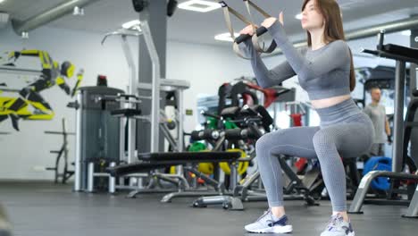 Fitness Workout Beautiful Girl Doing Squat Exercise in Gym Crossfit Training Fitness Workout Beautiful Girl Doing Squat Exercise in Gym Crossfit Training