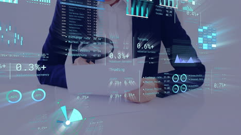 analyzing financial data and charts animation over businessperson working at desk