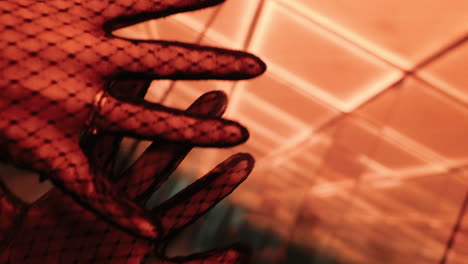 close-up of a woman's hands in black lace gloves