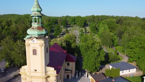 old church in ostrava sits at front of large cemetery in czech republic