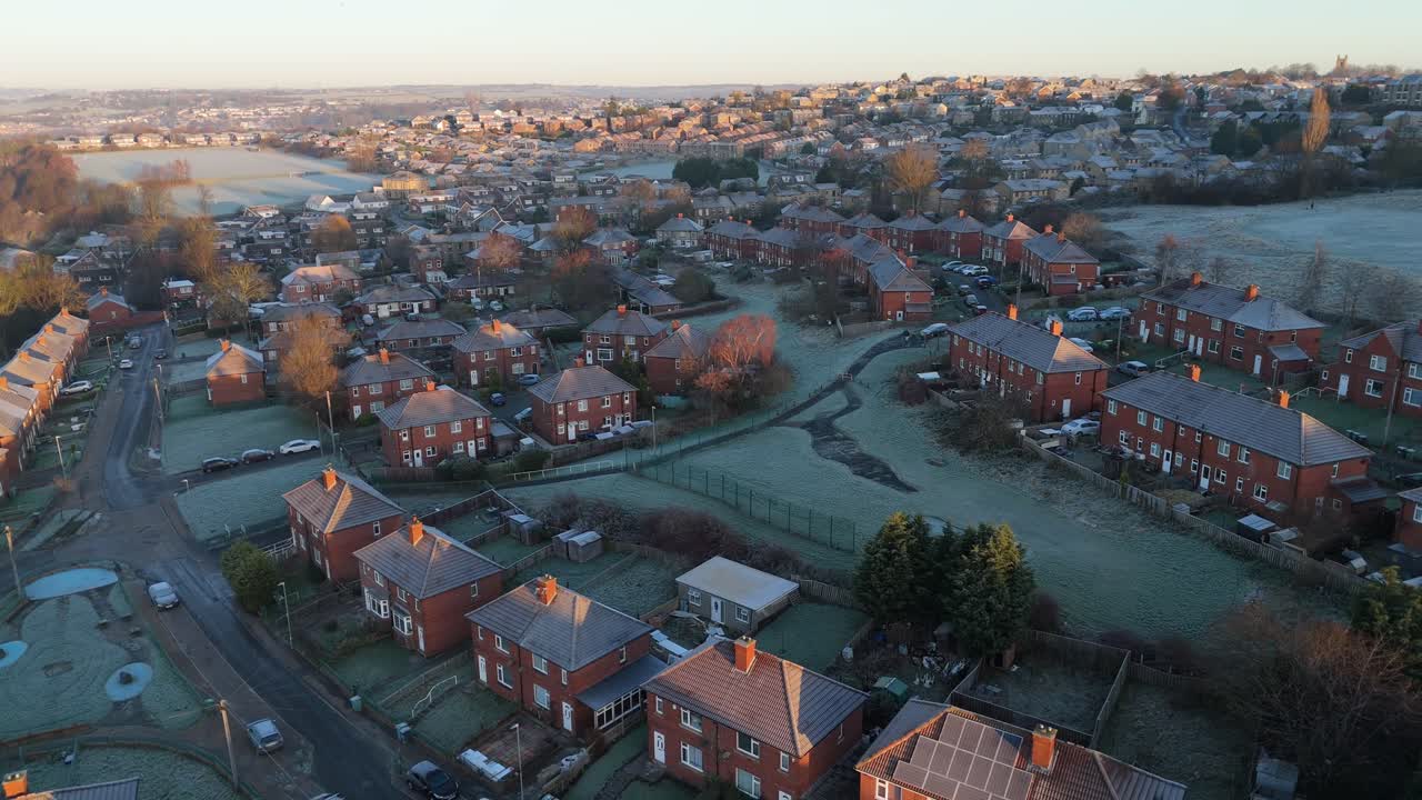 A drone's-eye view captures Dewsbury Moore Council estate's fame, a typical UK urban council-owned housing development with red-brick terraced homes and the industrial Yorkshire