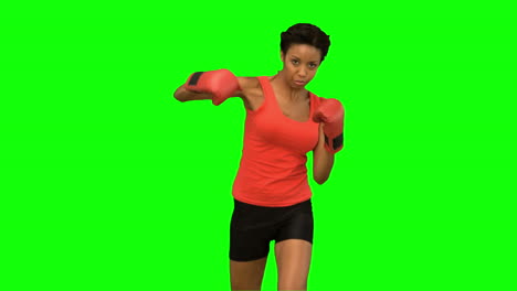 Attractive-woman-boxing-on-green-screen