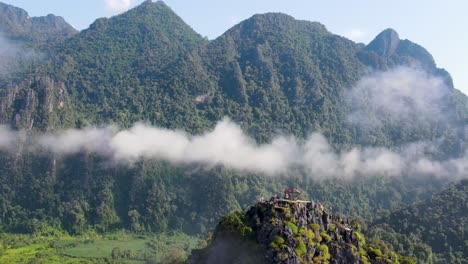 Aerial-View-Of-Nam-Xay-Viewpoint-In-Vang-Vieng,-Laos-With-Light-Clouds-Floating-Above