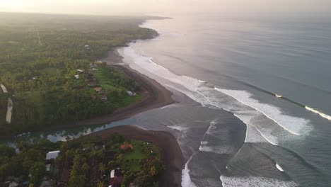 Balian-surfers-beach-with-blue-green-waves-swelling-along-the-shoreline