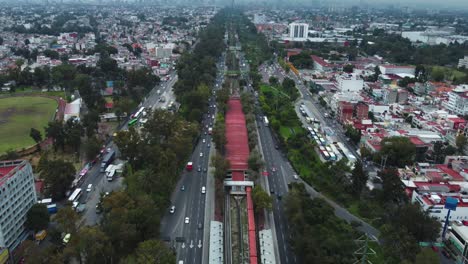 backwards shot of infinite insurgentes norte avenue road, mexico city