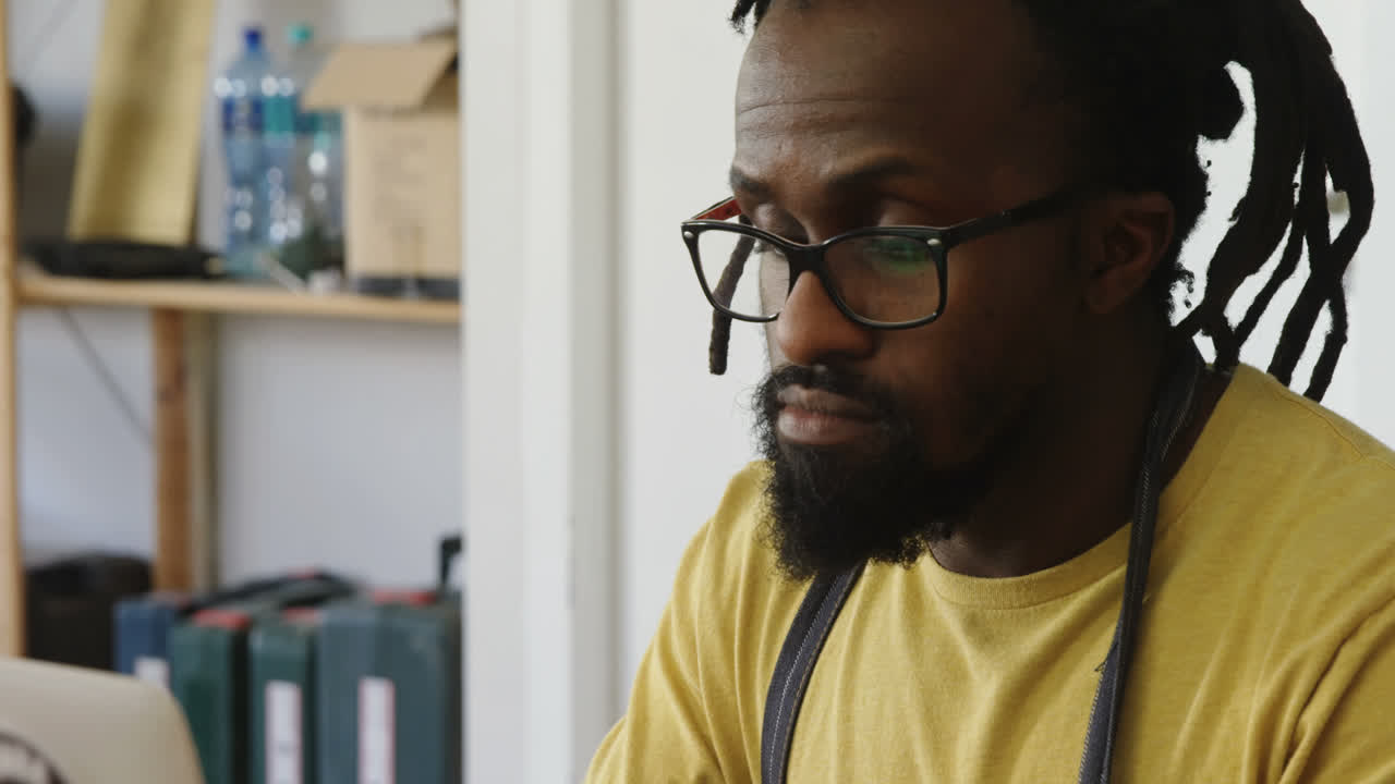 Carpenter using laptop at workshop 4k