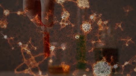 animación de estructuras moleculares en primer plano de una mano que sostiene un tubo de ensayo lleno de productos químicos