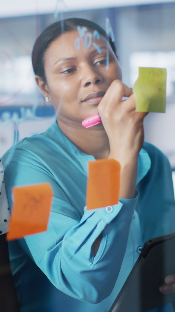 Vertical video of african american business people brainstorming, slow motion