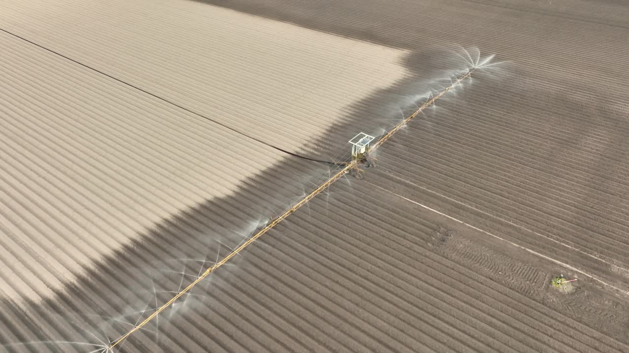 Irrigation overhead sprinkler machine spraying water