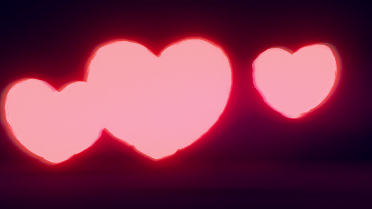 Red energy heart shapes on a dark background
