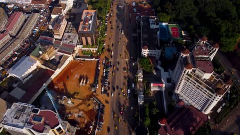 Aerial,-traffic-driving-on-a-main-street-in-downtown-Yaounde,-capital-of-Cameroon