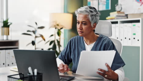 medical professional working at a desk