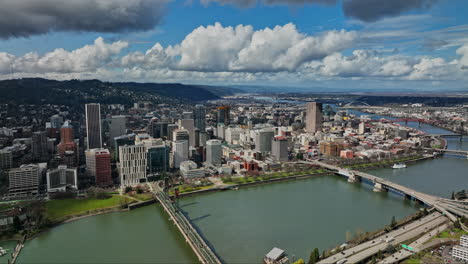 Portland-Oregon-Aerial-v110-flyover-Willamette-River-capturing-waterfront-downtown-cityscape,-bridges-spanning-across-the-water-and-hillside-views-in-summer---Shot-with-Mavic-3-Cine---August-2022