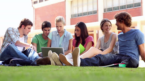 Classmates-sitting-on-the-grass-chatting-