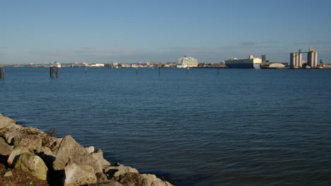 extra wide shot of southampton docks, taking across the solent at hythe marina